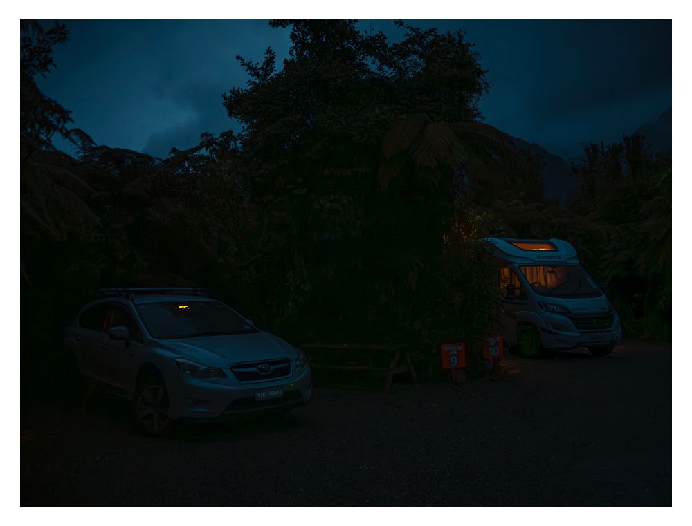 My car with just the smallest light leak around the rear vision mirror part of the front window parked up for the night in Franz Jospeh township.  I have made custom window panels from core-flute board wrapped in guitar case grey felt, gives me complete privacy & crazy warmth 