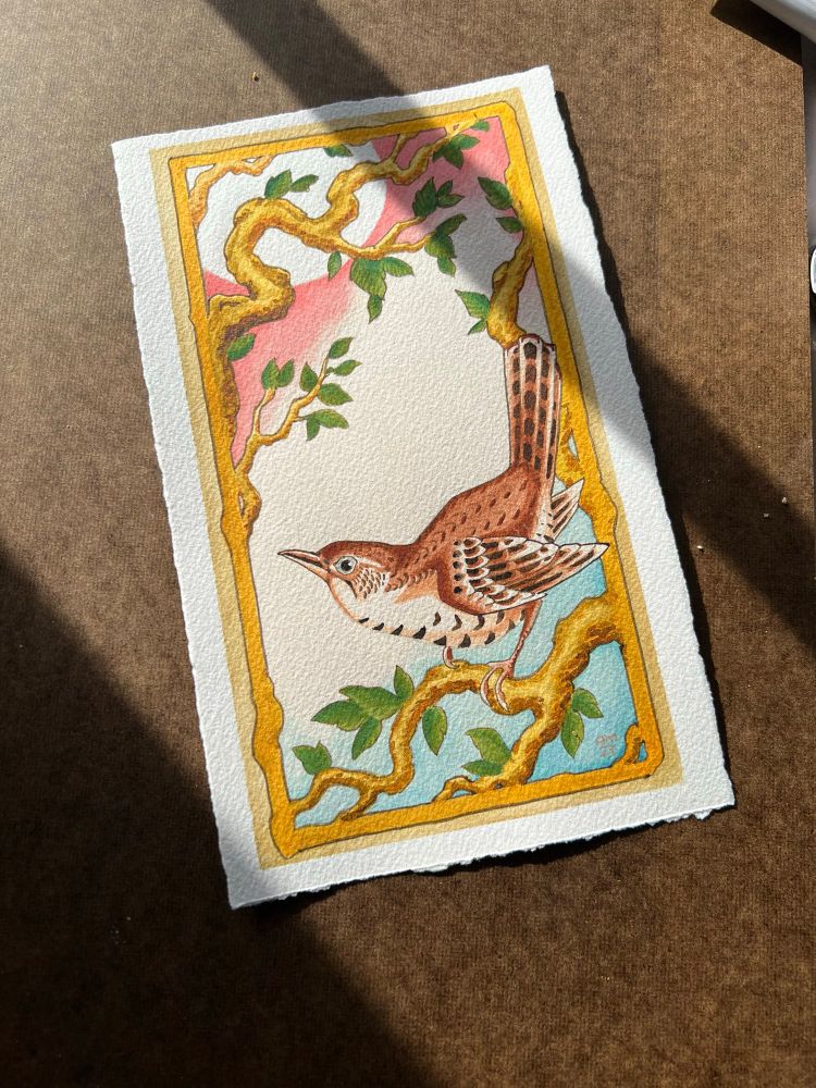 Watercolor painting of a house wren with an ornamental frame