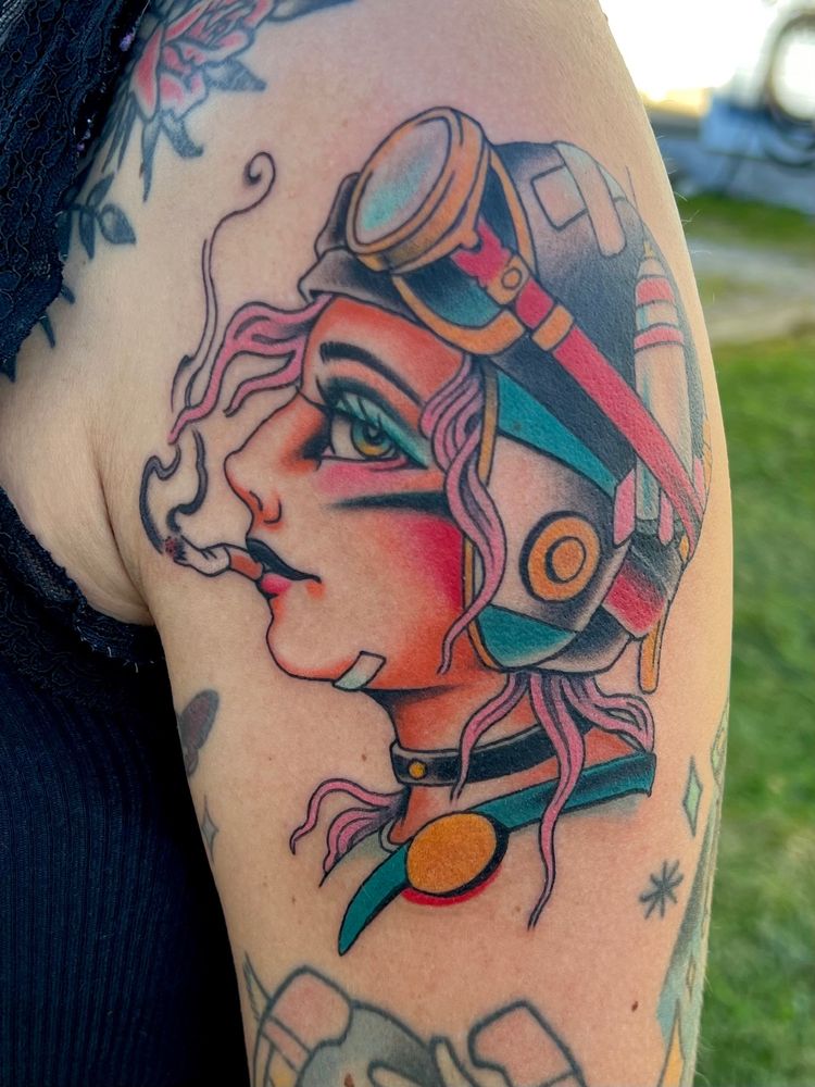 A traditional tattoo of the character tank girl 