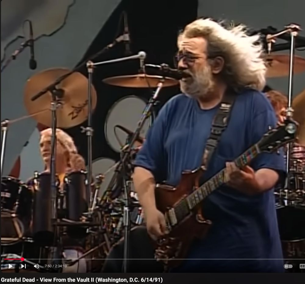 Jerry Garcia 06/14/91 at RFK Stadium. His hair is blowing in the wind and he looks majestic.