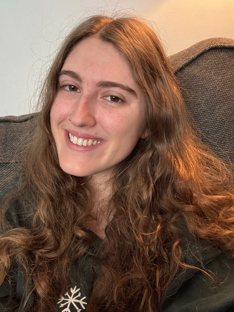 A photo of me, I have brown curly hair (technically darker blonde by hair dresser standards) and brown eyes