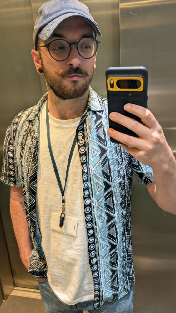 Wills standing in a lift taking a selfie