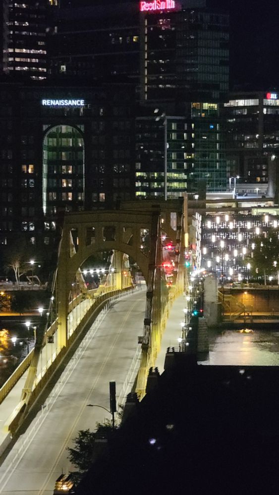 Fort Duquesne Bridge at night, with downtown Pittsburgh in the background