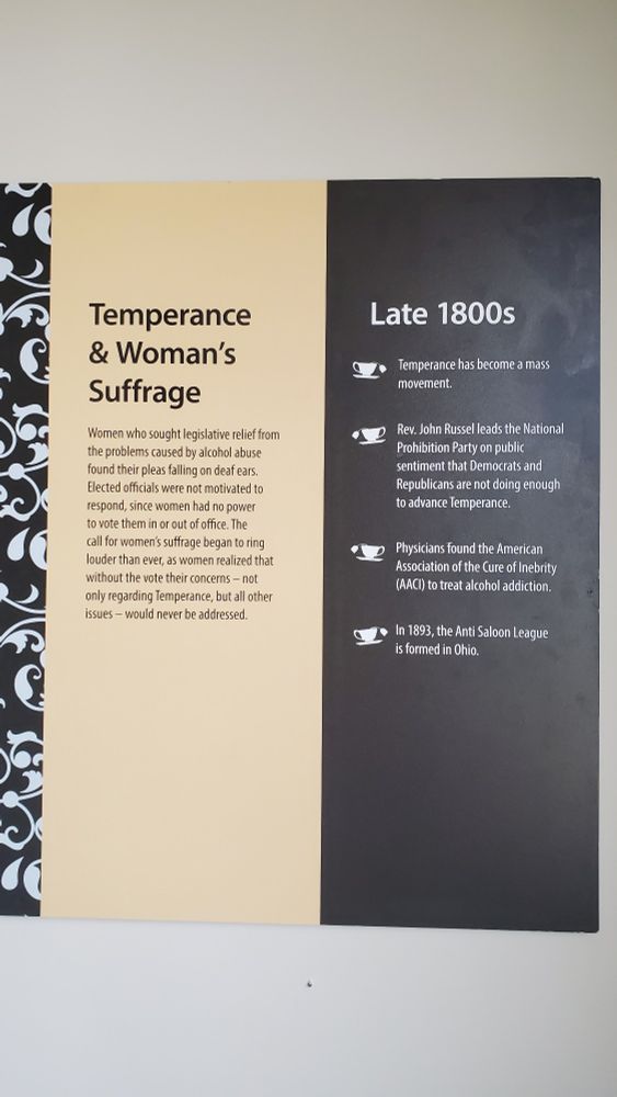 Placard from the Mystic Seaport Museum describing how male alcohol abuse was a major problem in the industrial revolution but women lacked political power to demand policy changes. 