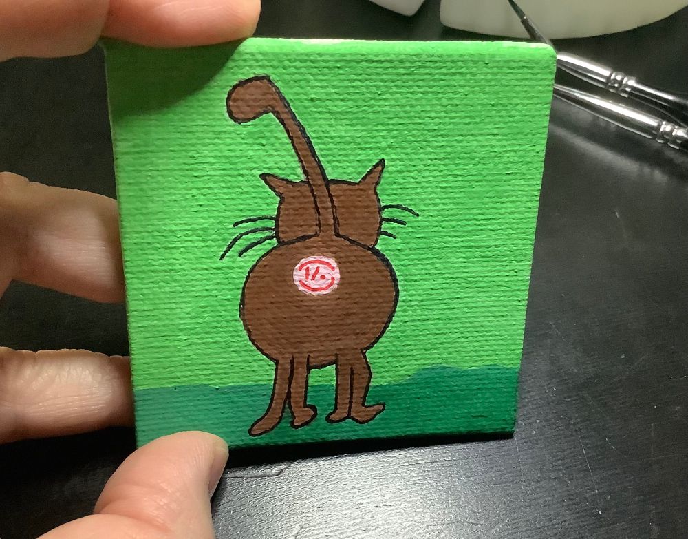 Bobs Burgers fan art acrylic painted fridge magnet of the rear end of a cat, highlighting the butt hole, for humor.