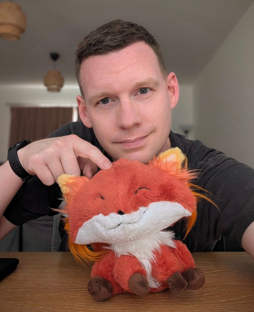 Me, sitting behind a cuddly toy of a fox. Ok it's obviously Firefox.