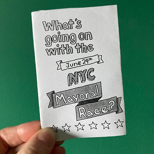 Hand holding zine titled "What's Going on with the NYC Mayoral Race?"