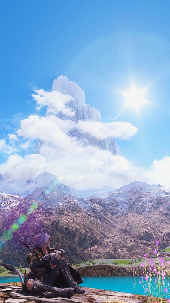 A miqo'te sits on a rockface in Urqopacha, gazing over his shoulder at the mountain vista across the lake. The mountains are wreathed in fluffy white clouds, standing tall against a clear blue sky.