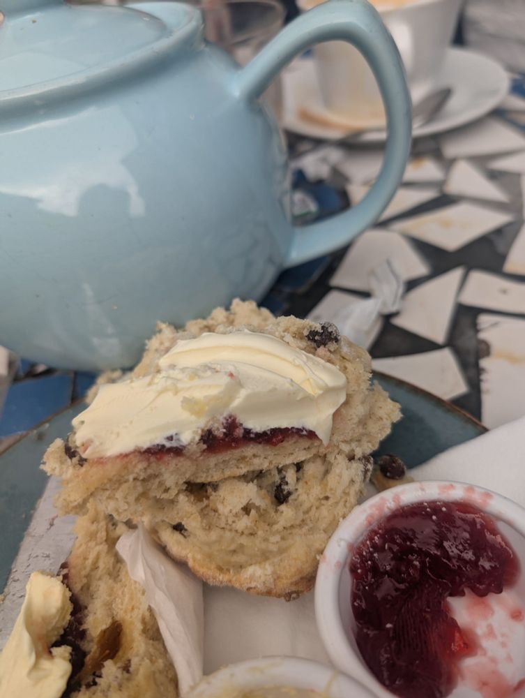Scone with Jam first then cream.
