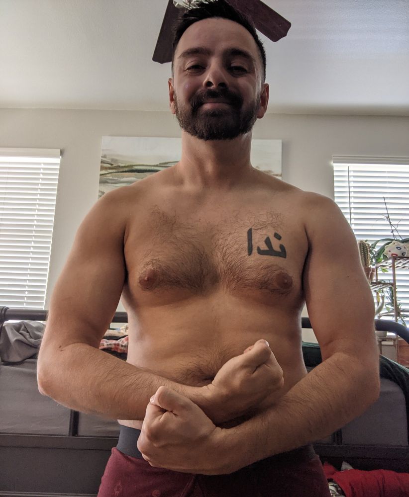 Me flexing at my camera