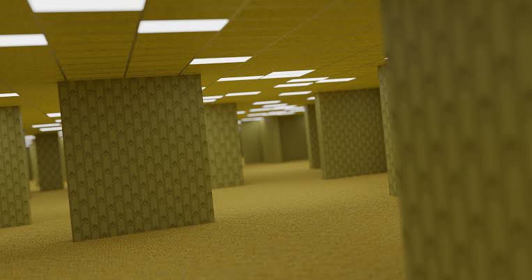 A yellow room with segmented walls and fluorescent lights overhead.