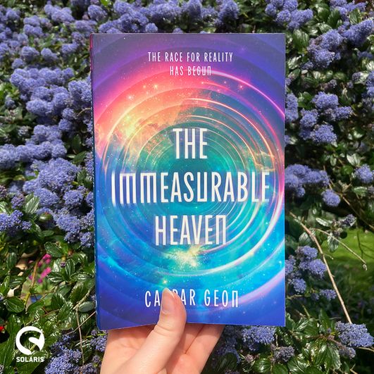 A copy of THE IMMEASURABLE HEAVEN by Caspar Geon held up in front of a California Lilac bush. The white Solaris logo is in the bottom left corner.