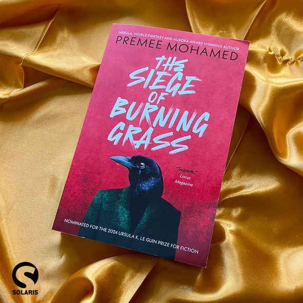 Against a background of gold fabric, the paperback cover for THE SIEGE OF BURNING GRASS by @premeesaurus. The black Solaris logo is in the bottom left corner.
