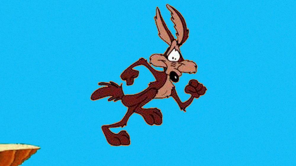 Wile E. Coyote hangs in the air after running of the edge of a cliff