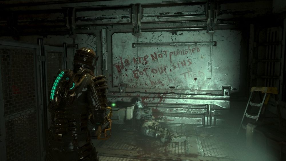 a screenshot of the 2023 Dead Space remake, showing a wall with writing, in blood, presumably by the corpse slumped against the wall: "We are not punished for our sins but by them" 