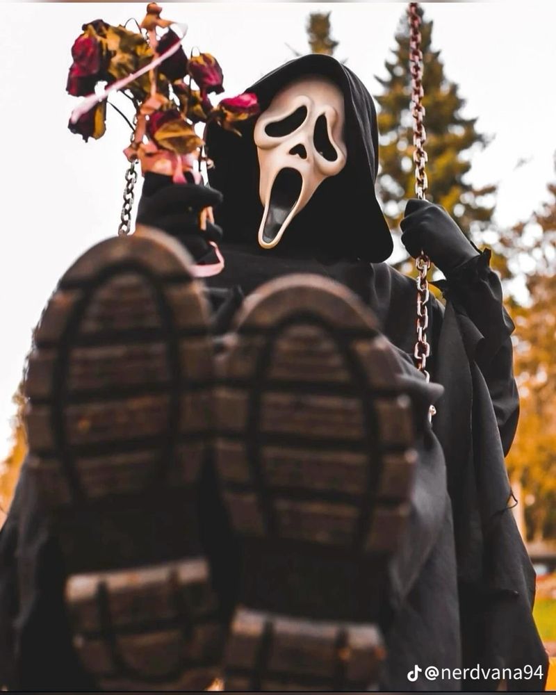 ghost face riding a swing being a cutie