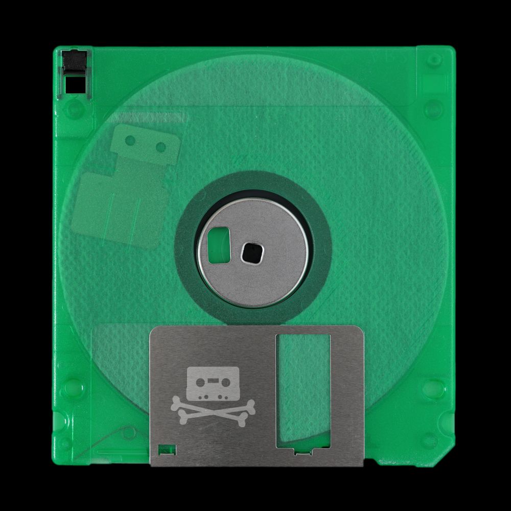 A green floppy disk with a piracy logo engraved on it 