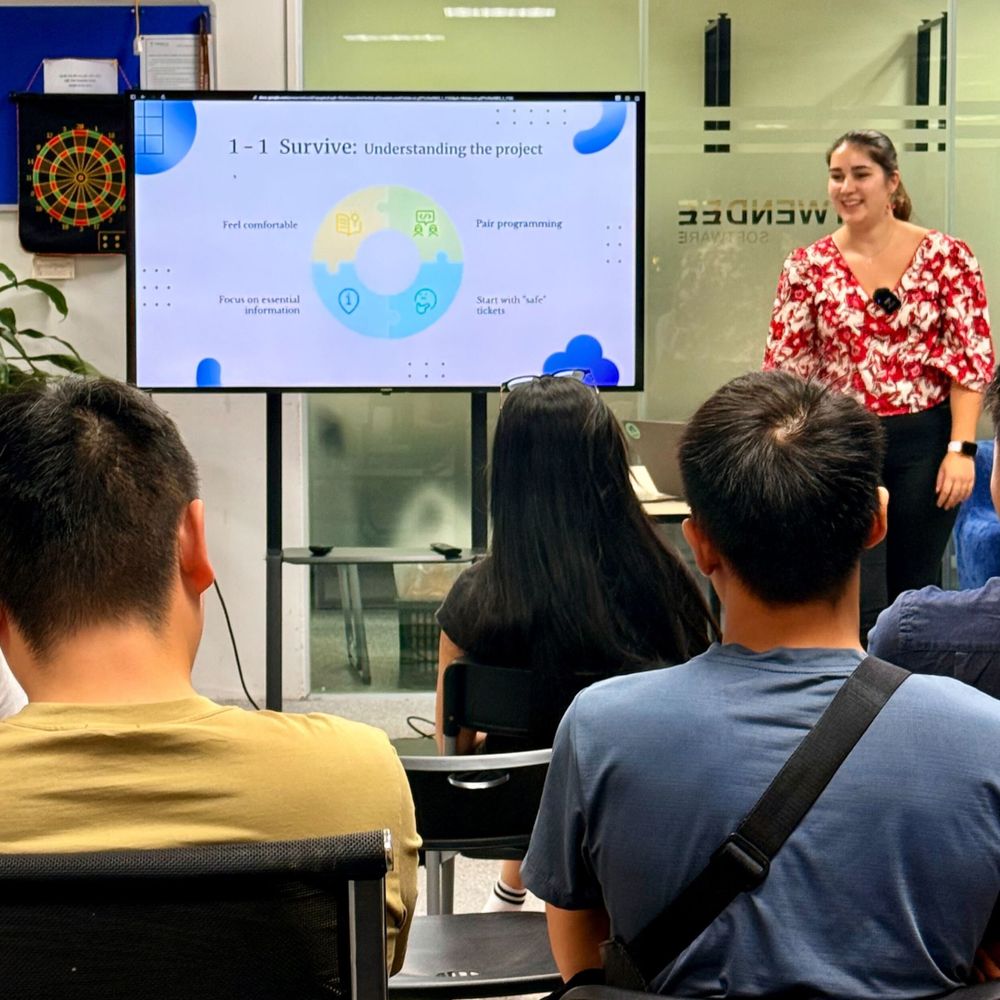 Marie giving her talk on a developer's first big project