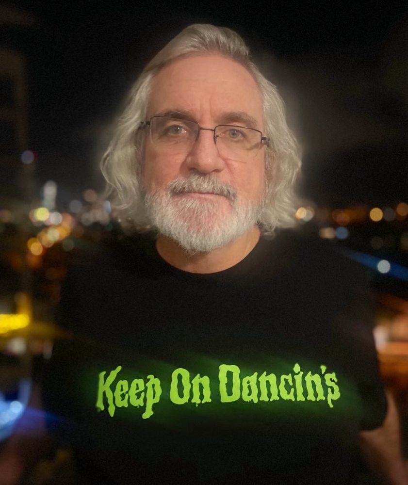 wearing a T-shirt of the band Keep On Dancin’s