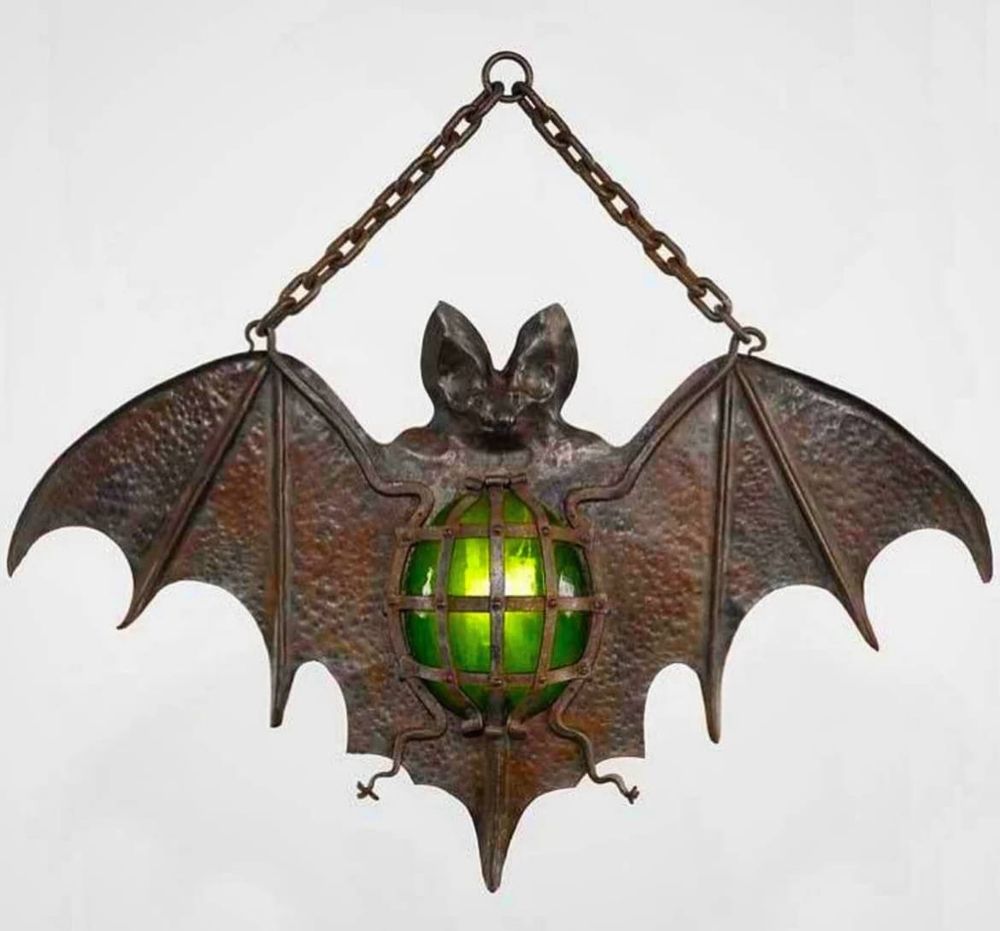 “This luminous bat recalls the popular tradition of nailing the beast to a barn door in order to ward off bad luck. But this particular example is an ornament designed to decorate the wall of a room.”
https://museelesecqdestournelles.fr/en/oeuvres/bat-shaped-night-light