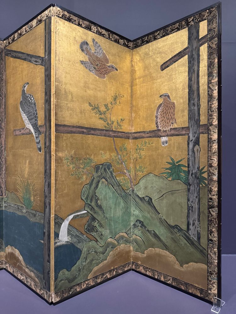 closeup photo of right two panels
with two goshawks