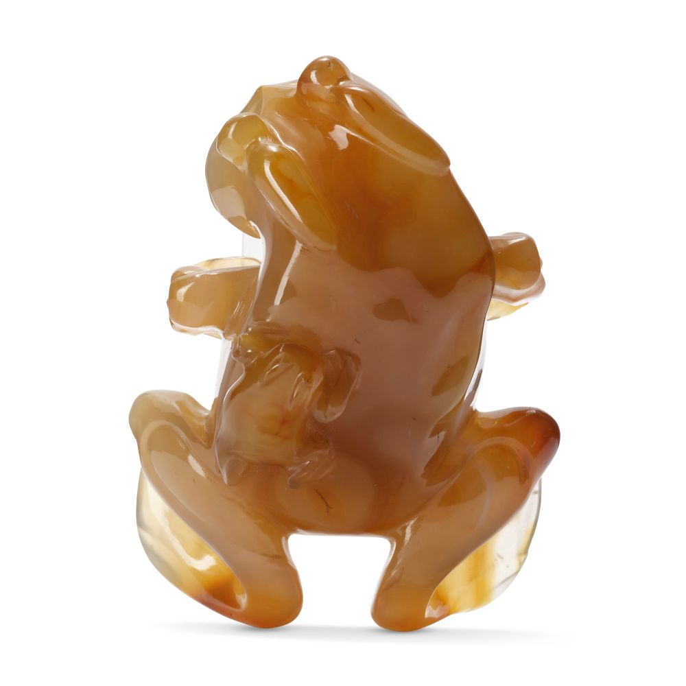 official auction photo 3, top down profile on white background
carved orange agate figure of a frog/toad with tiny baby on back
