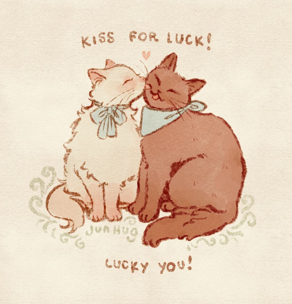A doodle of two kitties, white longhair one with blue a bow under its chin and brown shorthair with a blue bandana in the same place. White one is licking brown one's face. A handwritten text says "Kiss for luck! Lucky you!"