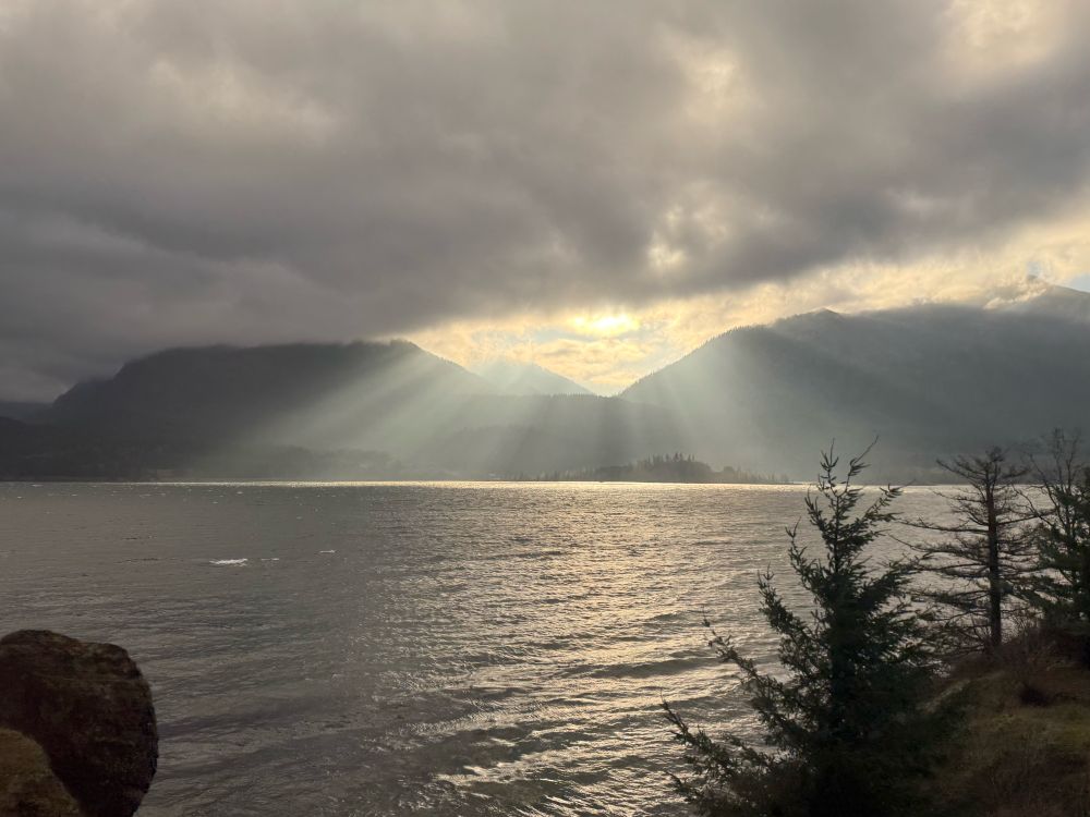 Morning light through the clouds over the Cascade mountains in Oregon