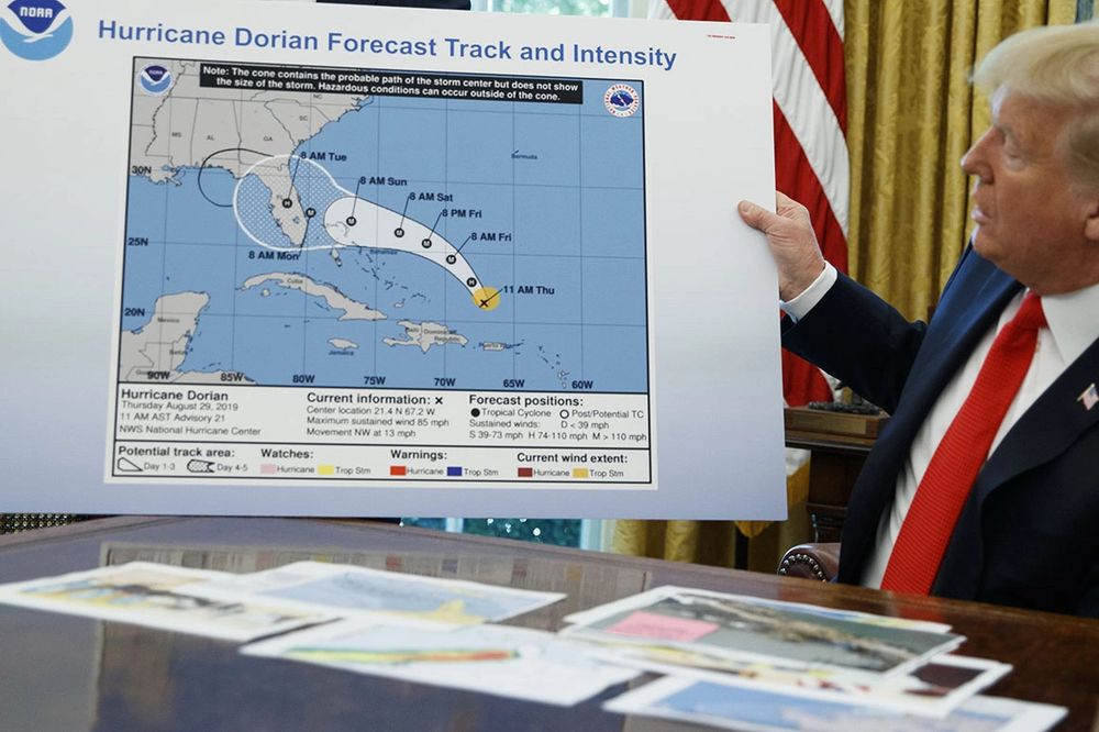 A guy holding a weather map which he has doctored with a Sharpie in an attempt to make it seem like he knows what he’s talking about. 