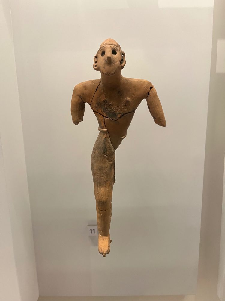 Anthropomorphic figurine, reddish-brown, male, incomplete