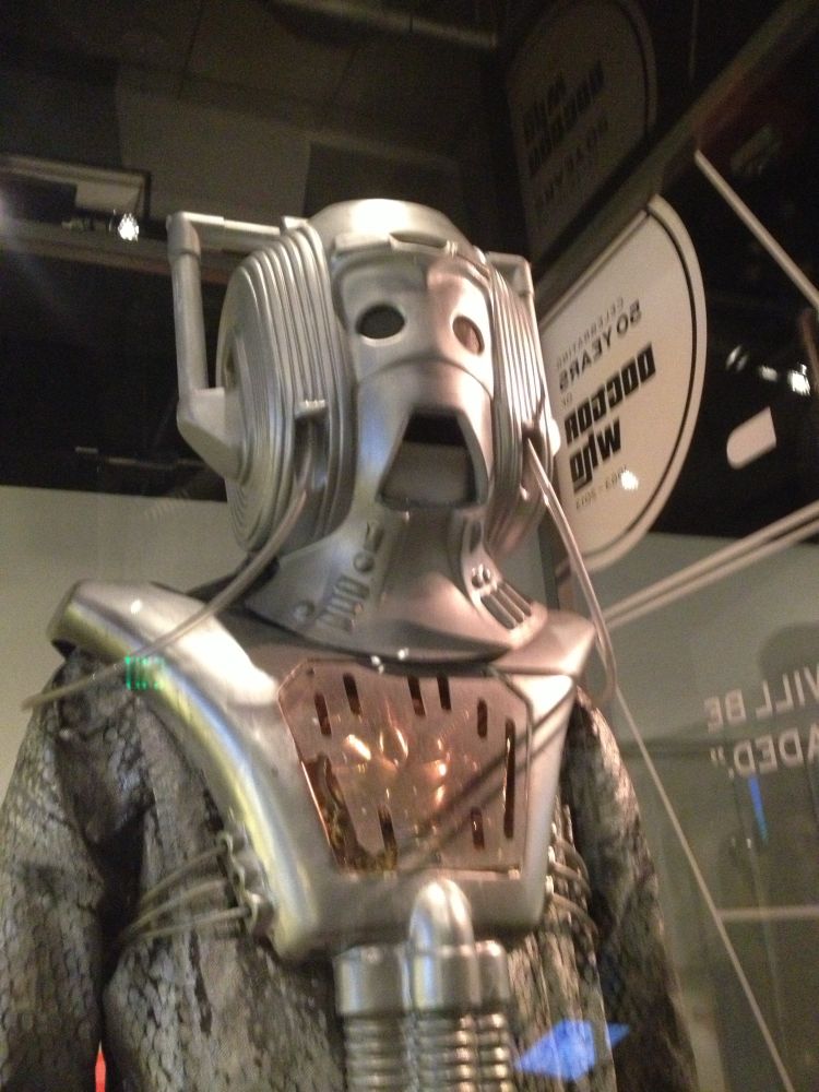 A cyberman costume from Dr Who. The lights reflecting off the display case create a sci-fi vibe. Photo by Robert Emond. 