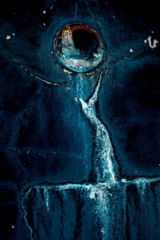 a celestial female form reaching up to a moon like orb, archival pigment print composed of deep blues