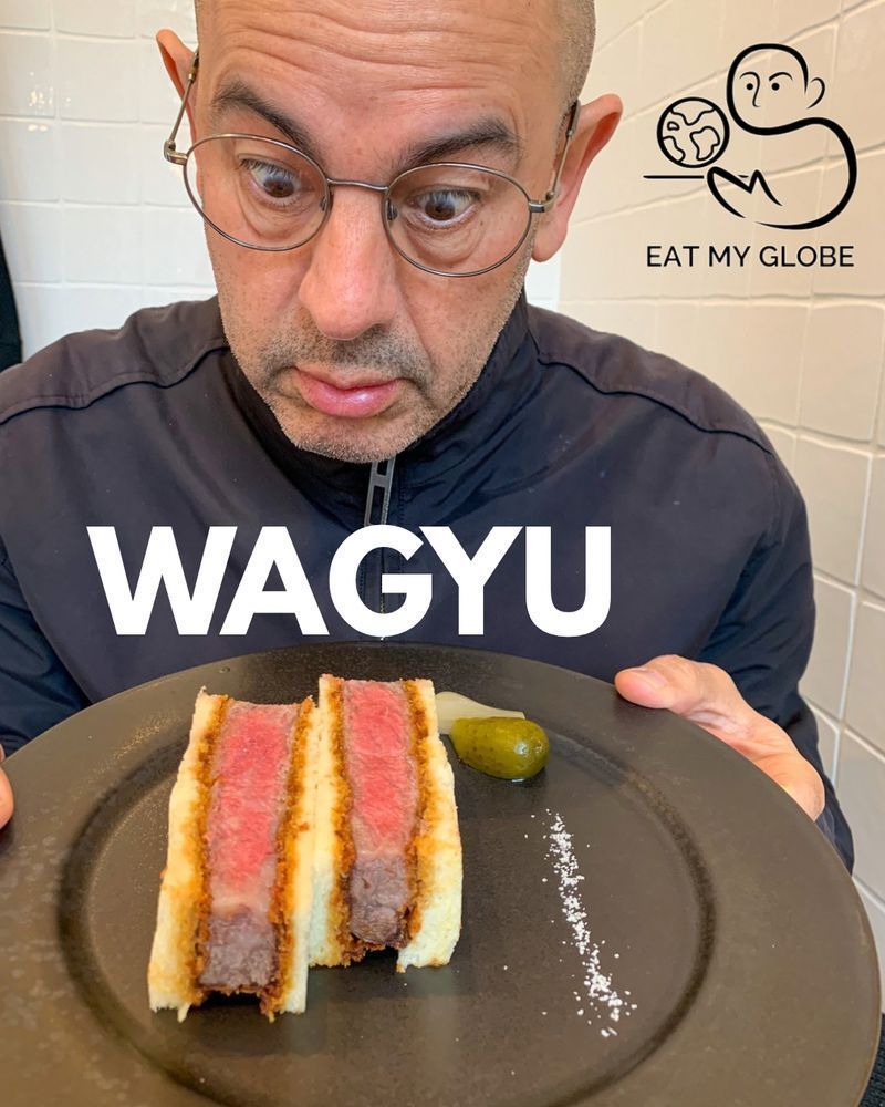 Simon Majumdar staring at Wagyu. Also includes the word, 
