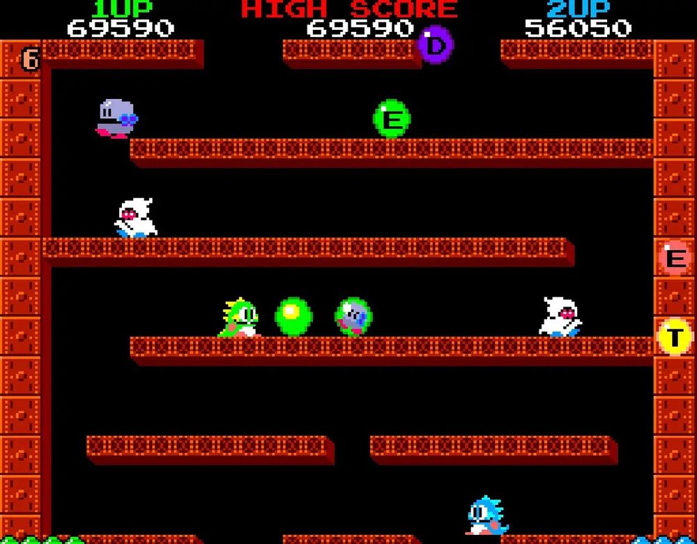 Bubble Bobble. Two dragons, one green (Bub) and the other blue (Bob), thwart enemies with bubbles.