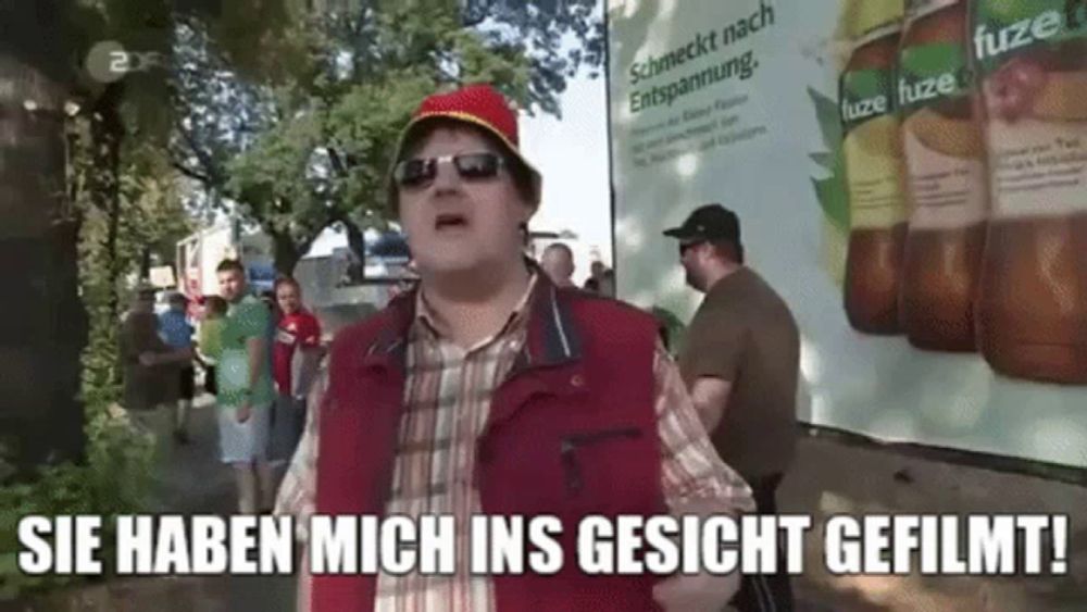 a man wearing sunglasses and a red vest says sie haben mich ins gesicht gefilmt ..