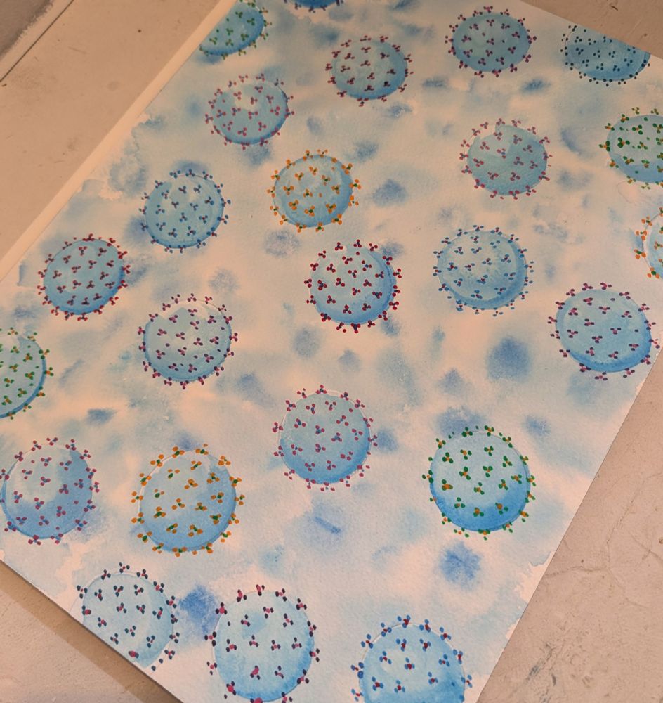 Watercolor painting of viruses in various colors
