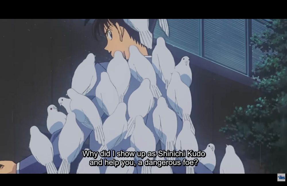 A screenshot from Detective Conan Movie 3: The Last Wizard of the Century featuring Kaito Kid disguised as main character Shinichi Kudo calling doves to him before disappearing in a magic trick.