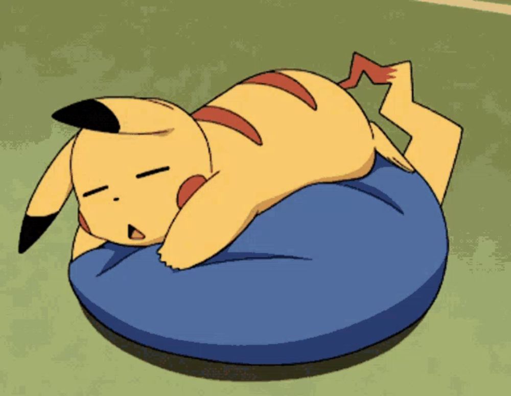 a pikachu is laying on a blue bean bag