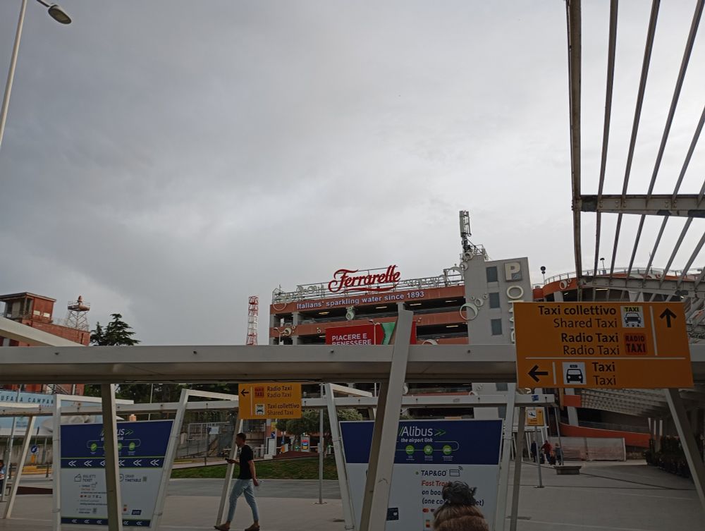A Ferrarelle advertisement on a parking building outside Naples Airport