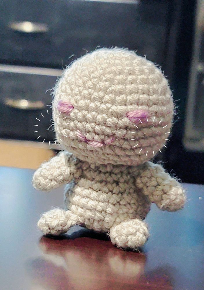 small crochet doll ; they look content!