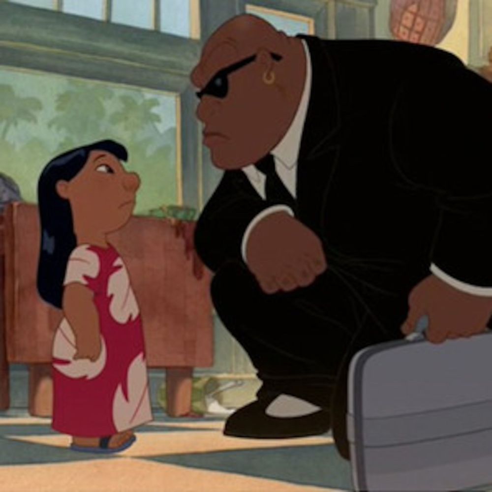 Agent Cobra Bubbles from Lilo and Stitch taking a knee to talk at eye-level to Lilo. His head is similarly shaped to the person in the original post.