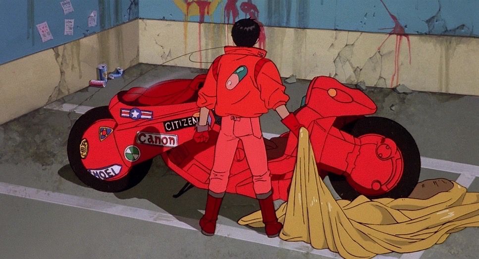 Character revealing ared motorcycle after removing the sheet. 