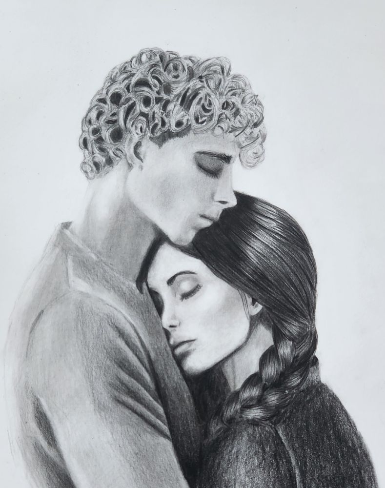  Man with blond curly hair holding a woman with brown hair, eyes closed. 