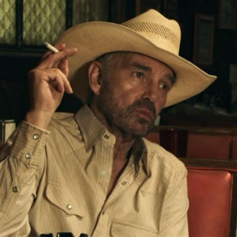 A man wearing a cowboy hat and holding a cigarette…thinking of things that could have been…
