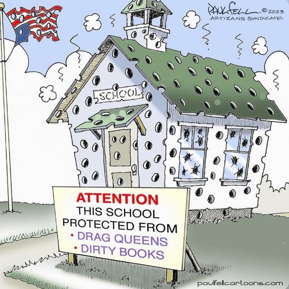 Picture of a school house riddled with bullet holes. A flag is flying upside down in the school yard. It is also riddled with bullet holes. A sign in front of the school reads, "Attention THIS SCHOOL PROTECTED FROM DRAG QUEENS & DIRTY BOOKS".