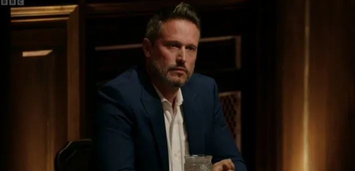 Kieran from The Traitors, sat at the round table 