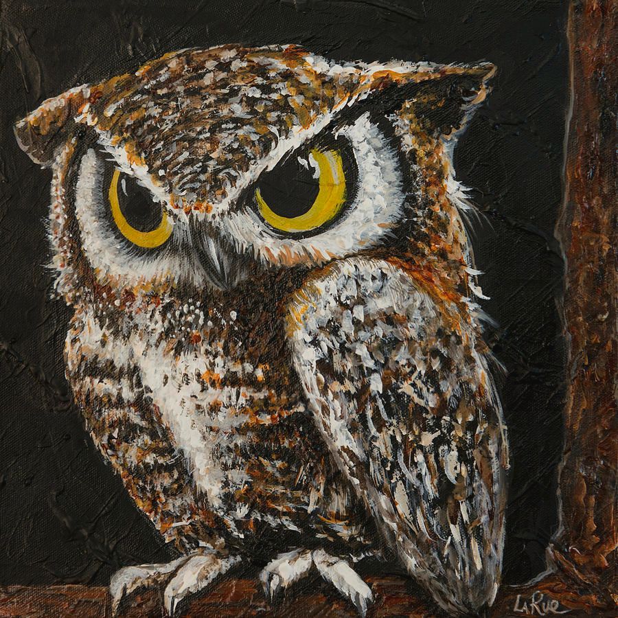 Brown owl with large yellow eyes, perching on a branch appearing very soft and cute.