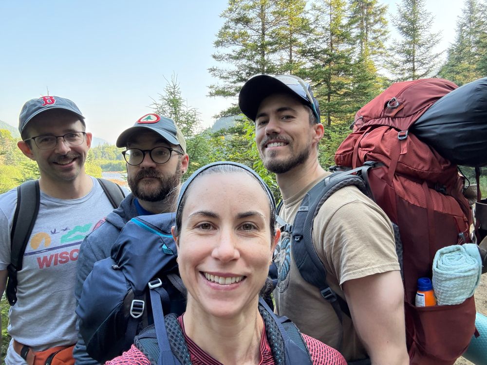 Group selfie we are all wearing backpacks and greasy