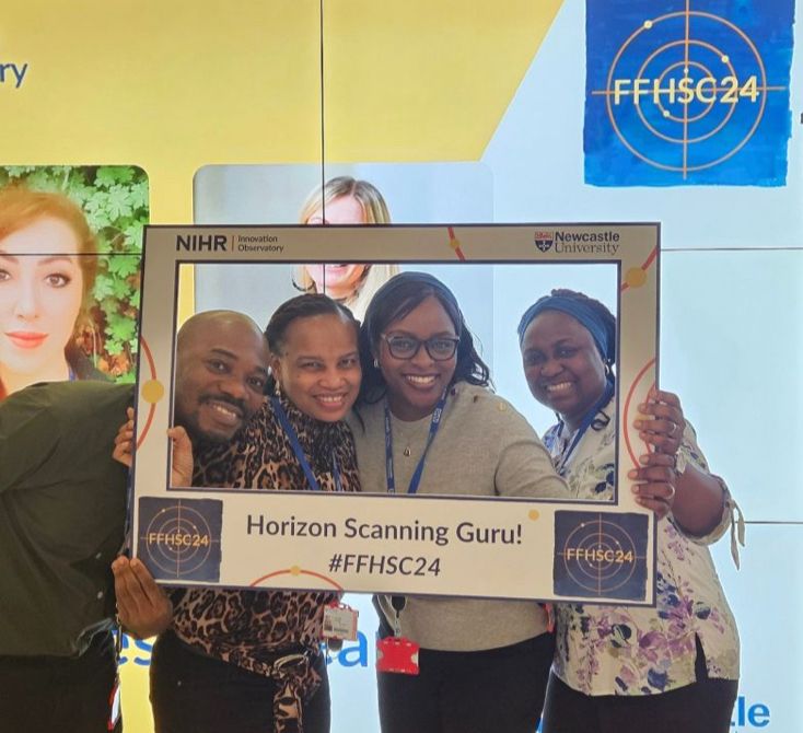 Some of our early career researchers looking delighted and energetic in a selfie frame reading “horizon scanning guru”