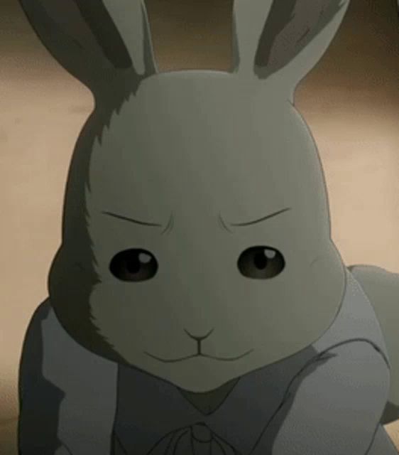 a close up of a cartoon rabbit with a serious look on his face .